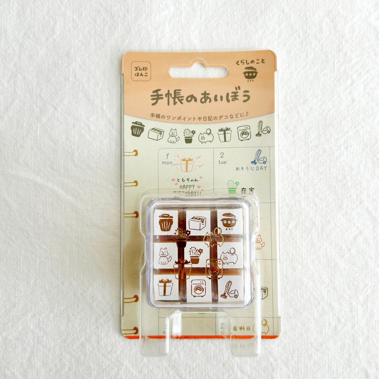 Packaged set of rubber stamps with cute living theme illustrations on a white background