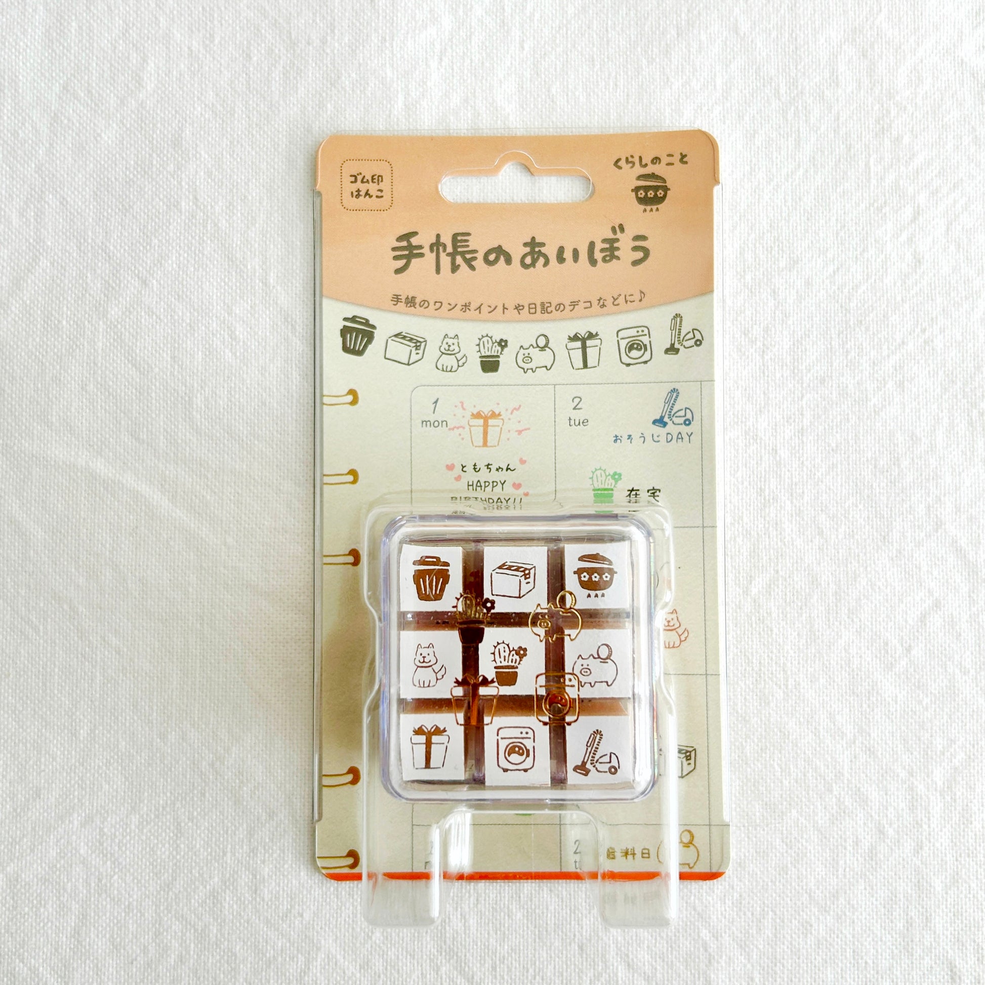 Packaged set of rubber stamps with cute living theme illustrations on a white background