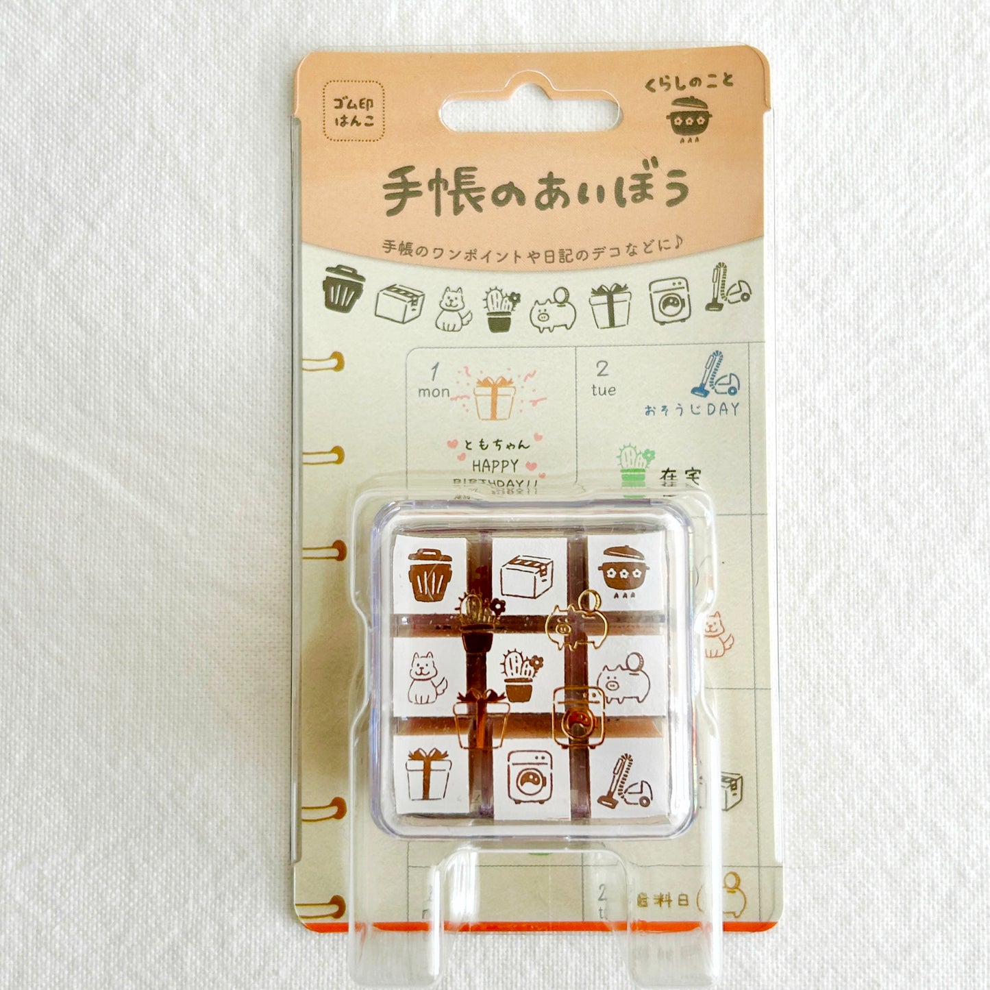 Packaged set of rubber stamps with cute living theme illustrations on a white background