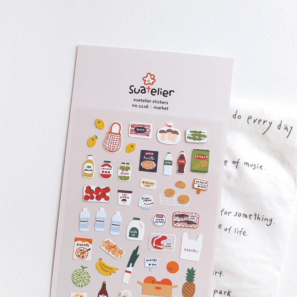 Sheet of Suatelier stickers with various food and product illustrations on a white background.