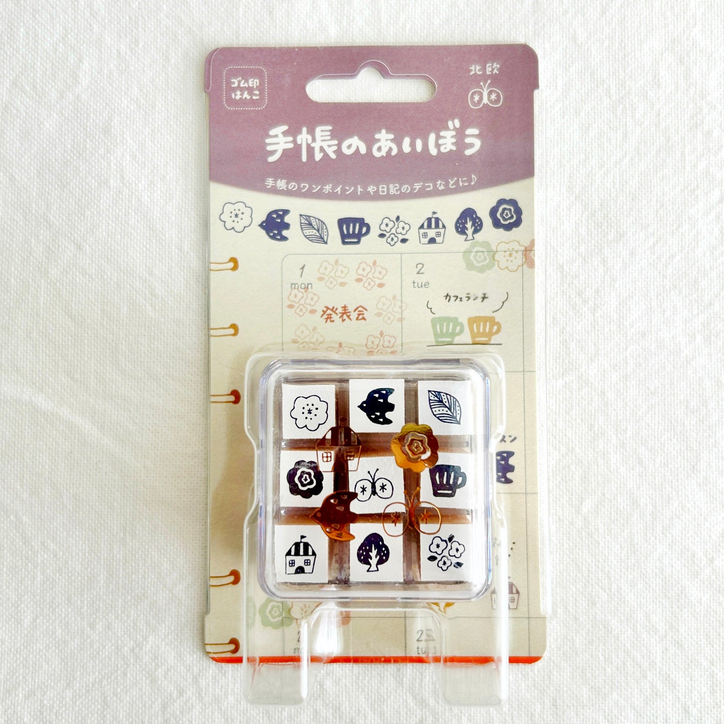 Packaged rubber stamps with various nordic theme designs on a white background