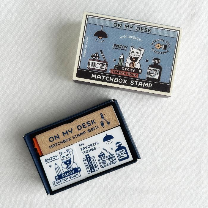 eric x SANBY Matchbox Stamp Set - On My Desk is a charming collection of stamps designed to capture the everyday beauty of desk life. 