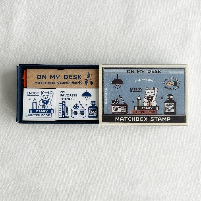 eric x SANBY Matchbox Stamp Set - On My Desk is a charming collection of stamps designed to capture the everyday beauty of desk life. 