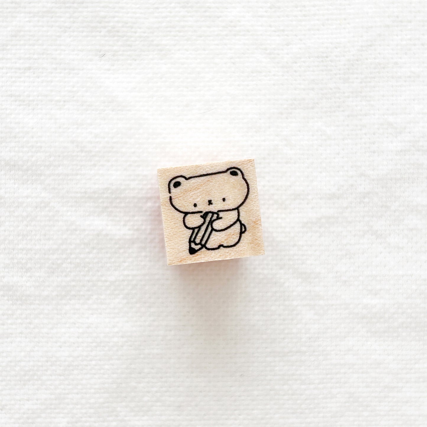 Small wooden stamp with a cute bear holding a giant pencil design