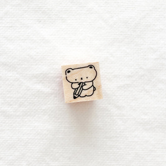 Small wooden stamp with a cute bear holding a giant pencil design