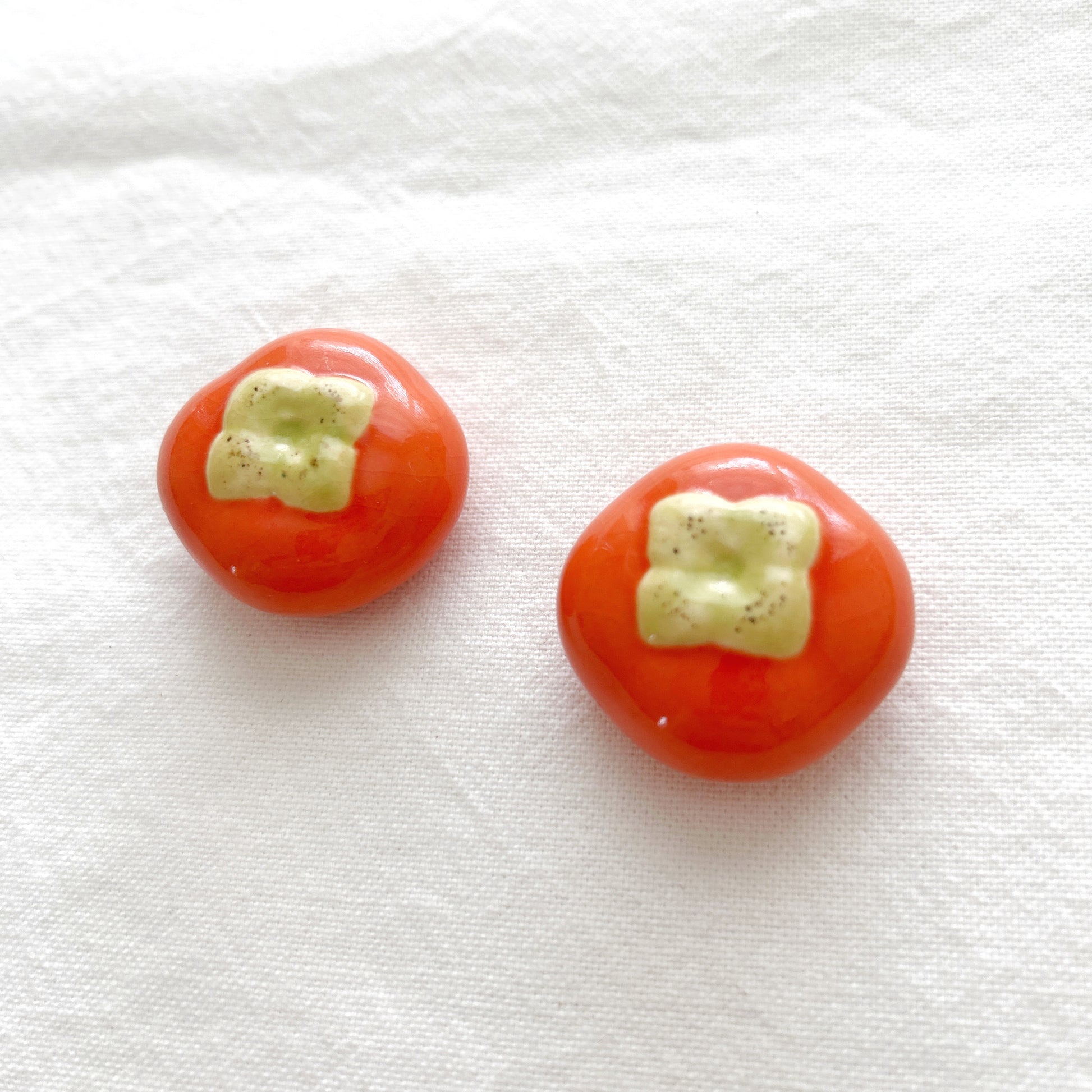 Round orange persimmon ceramic chopstick rest