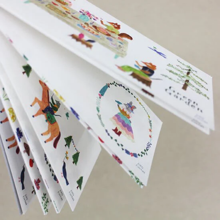 Aiko Fukawa memo pad titled 'Green Garden,' featuring lush green garden illustrations with animals and plants, Japanese stationery with a whimsical and nature-inspired theme.