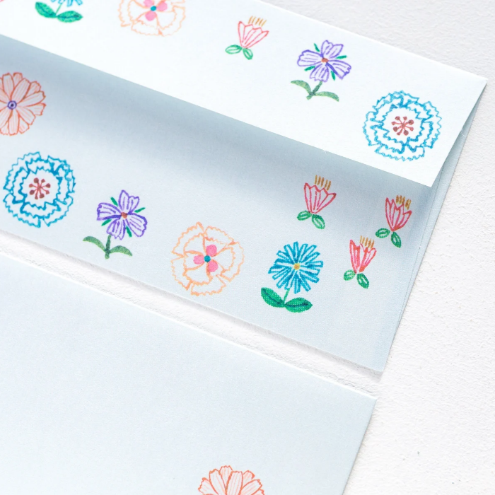 Aiko Fukawa letterhead featuring a cute cat and colorful floral design in a one-piece outfit, Japanese stationery with whimsical illustration style.