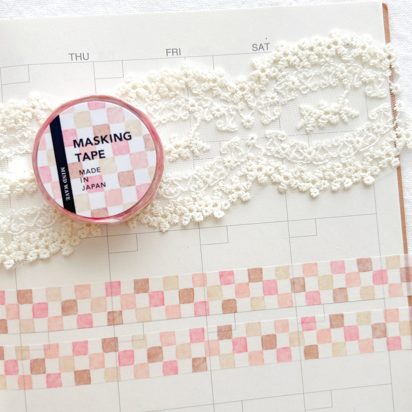 Washi tape with a pink and brown square pattern