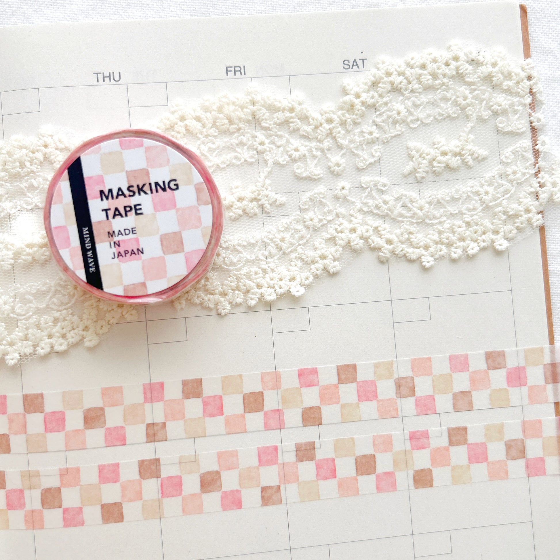 Washi tape with a pink and brown square pattern