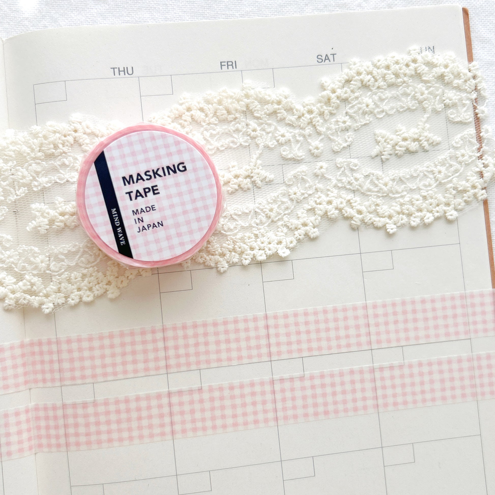 Washi tape with a pink grid pattern