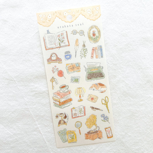 Sheet of decorative stickers with vintage-themed illustrations including typewriter, mantel clock and record player