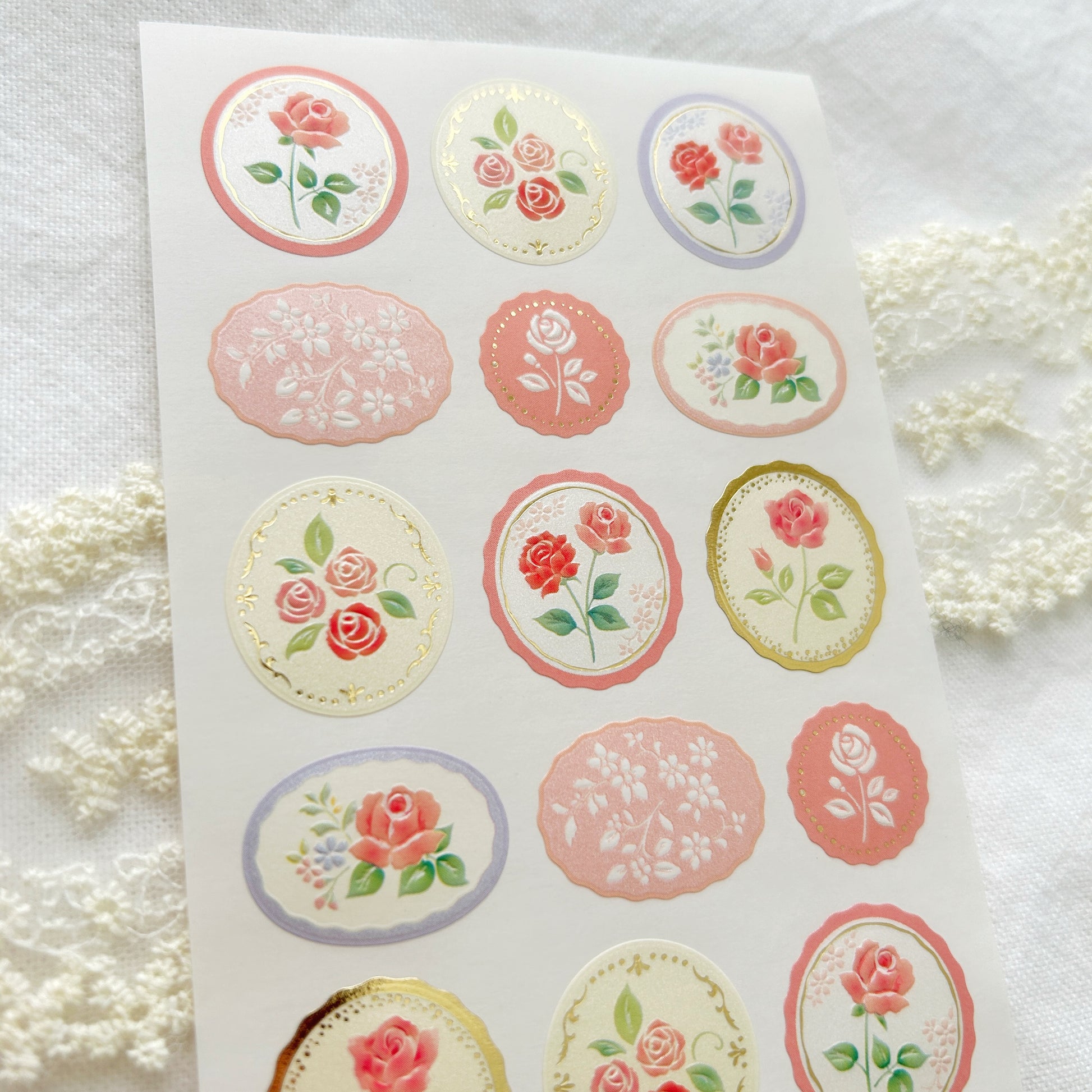 Sheet of floral stickers with roses on a white background
