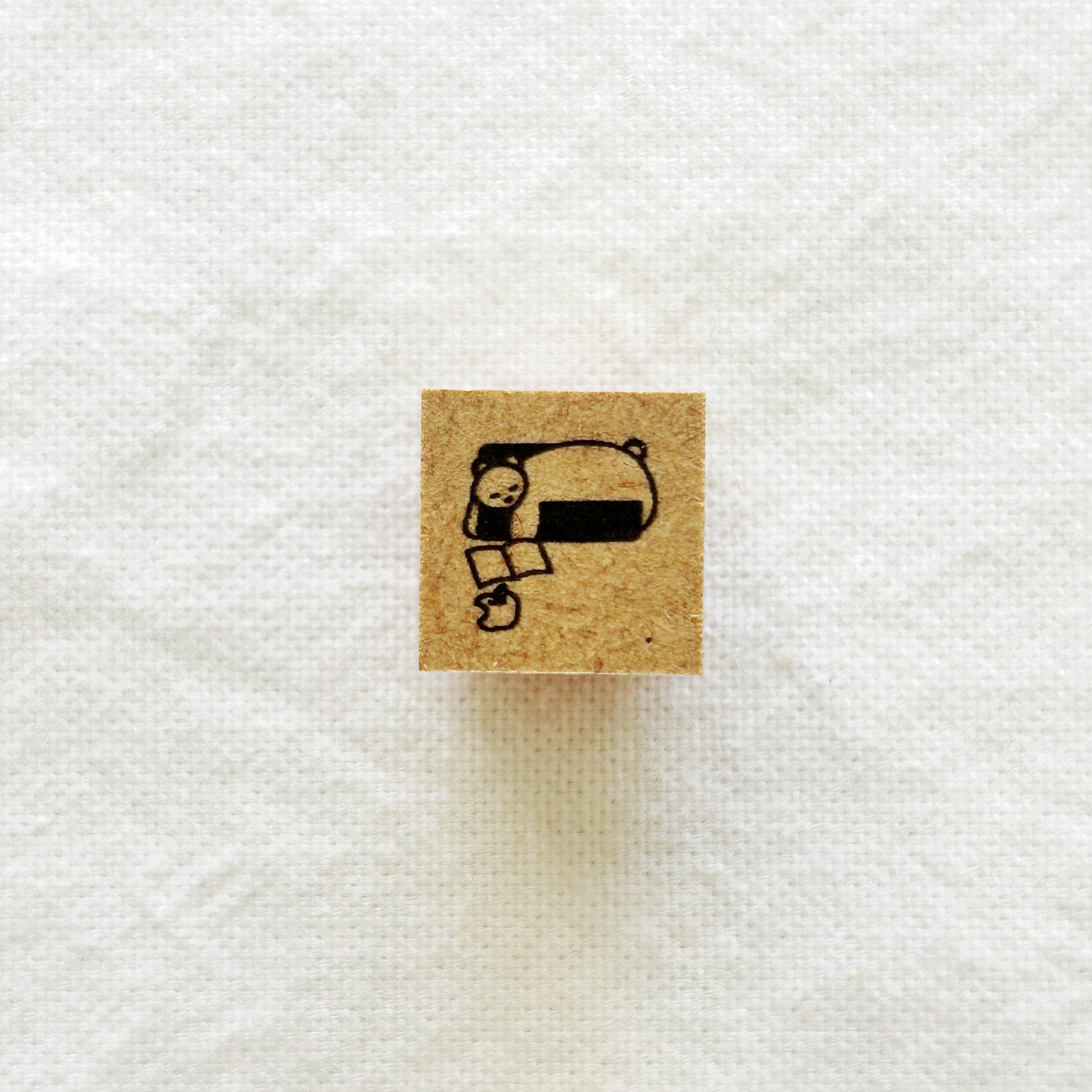 Small square rubber stamp with a sleeping bear