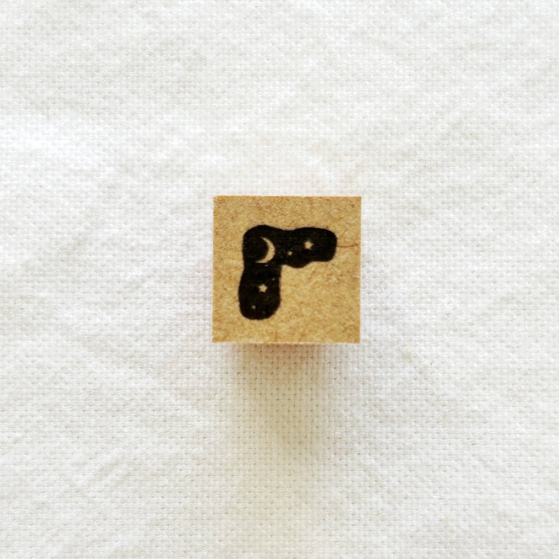Small wooden rubber stamp with the moon and stars