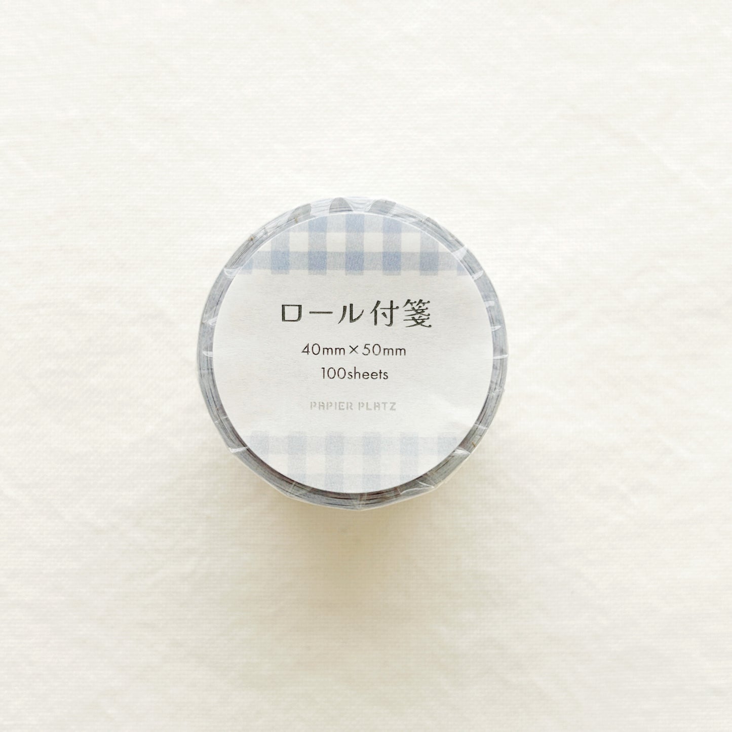 Rolled sticky notes in blue gingham design