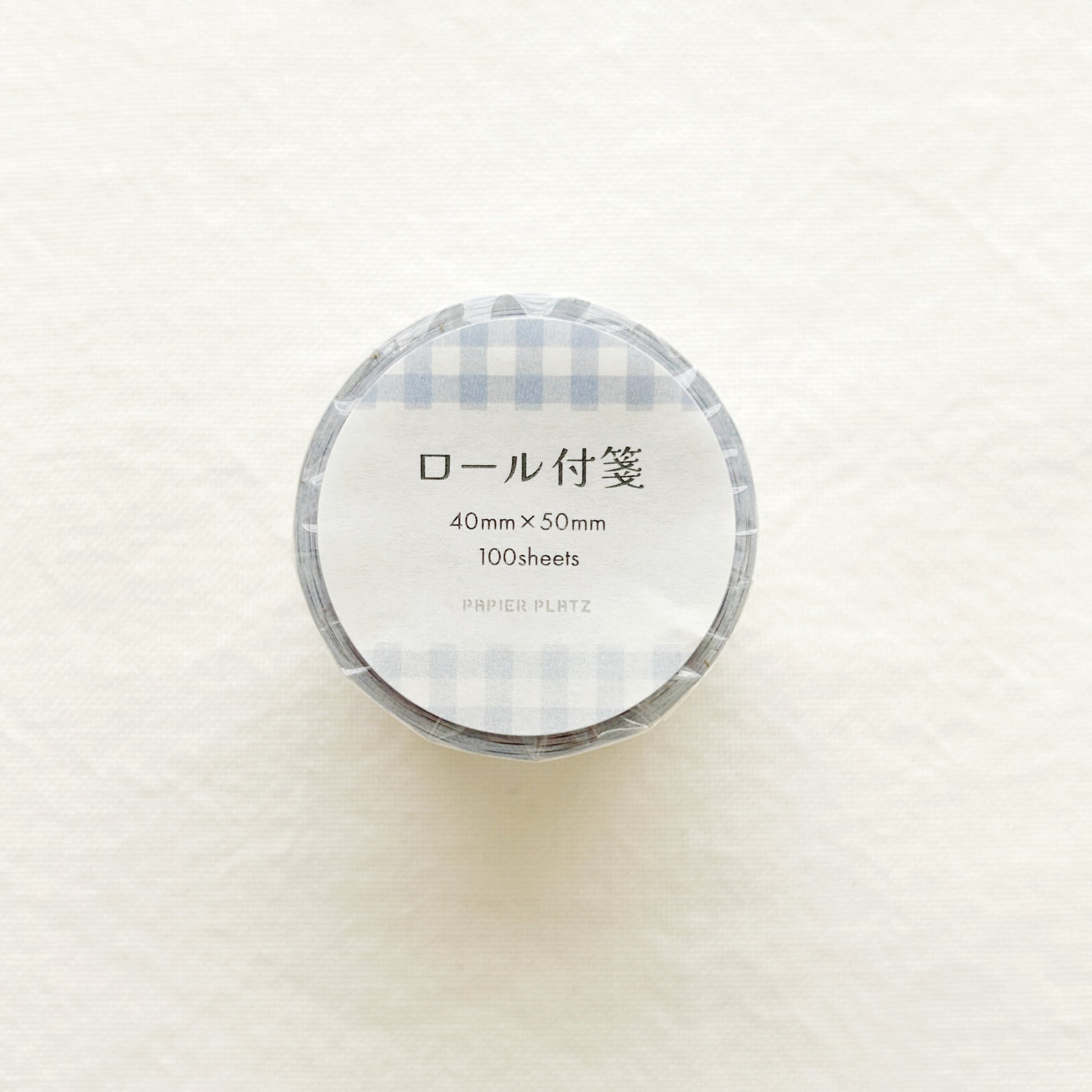 Rolled sticky notes in blue gingham design