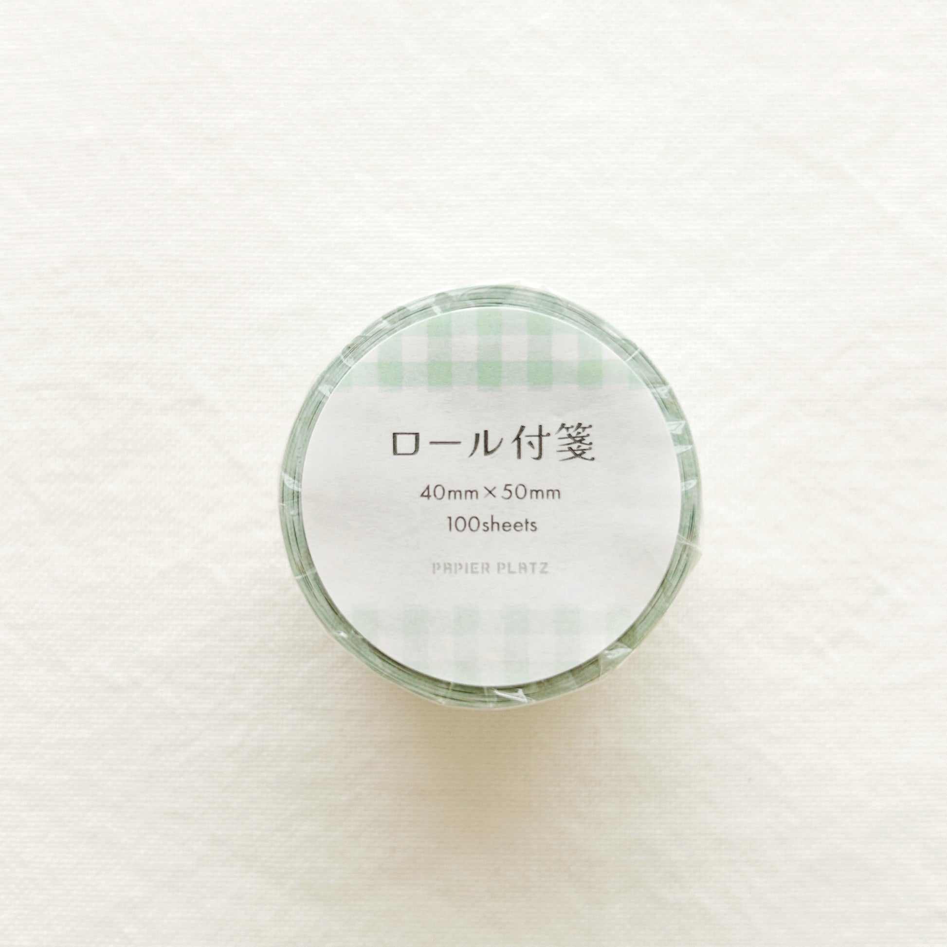 Rolled sticky notes in green gingham design