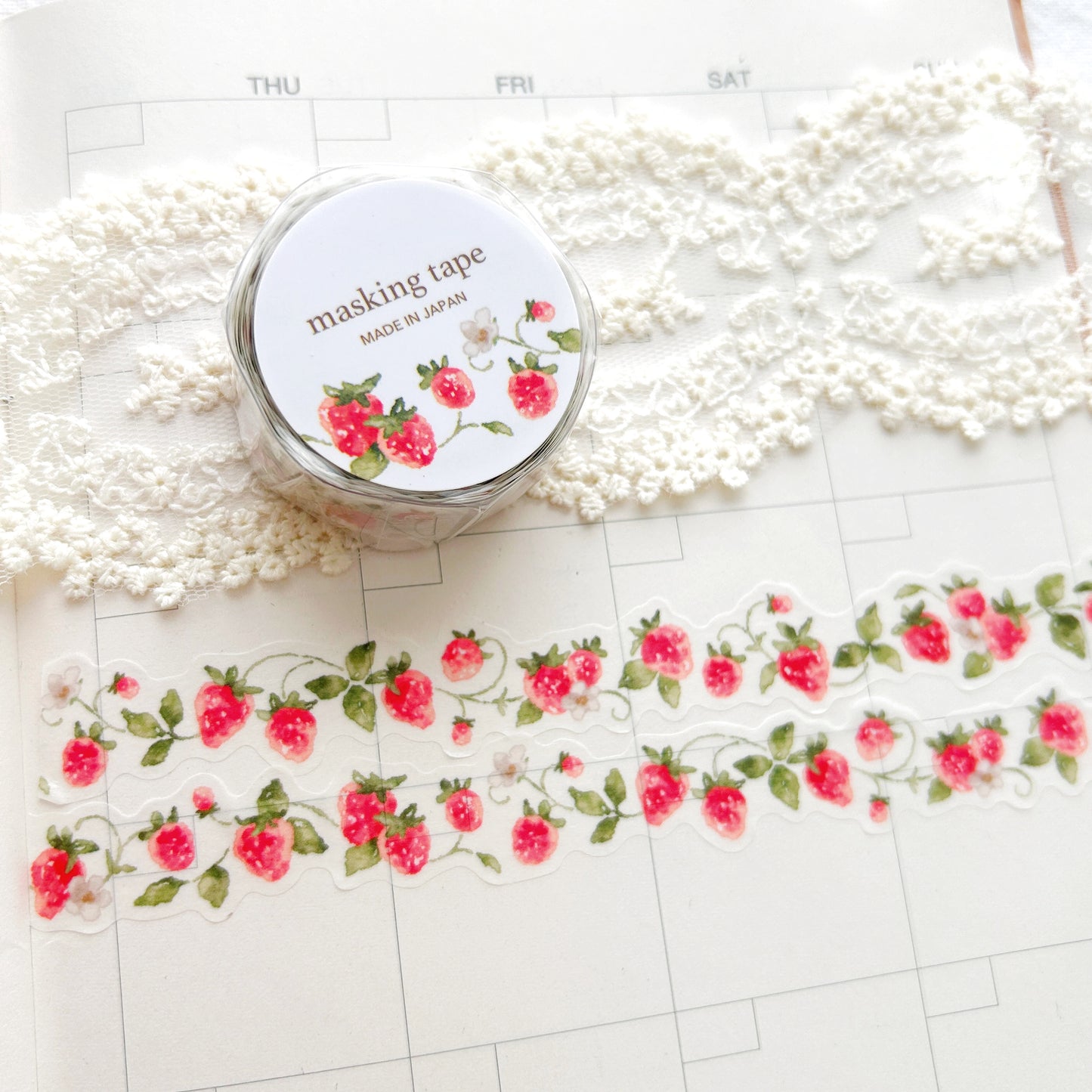 Washi tape with a whimsical strawberry on the vine design on a planner