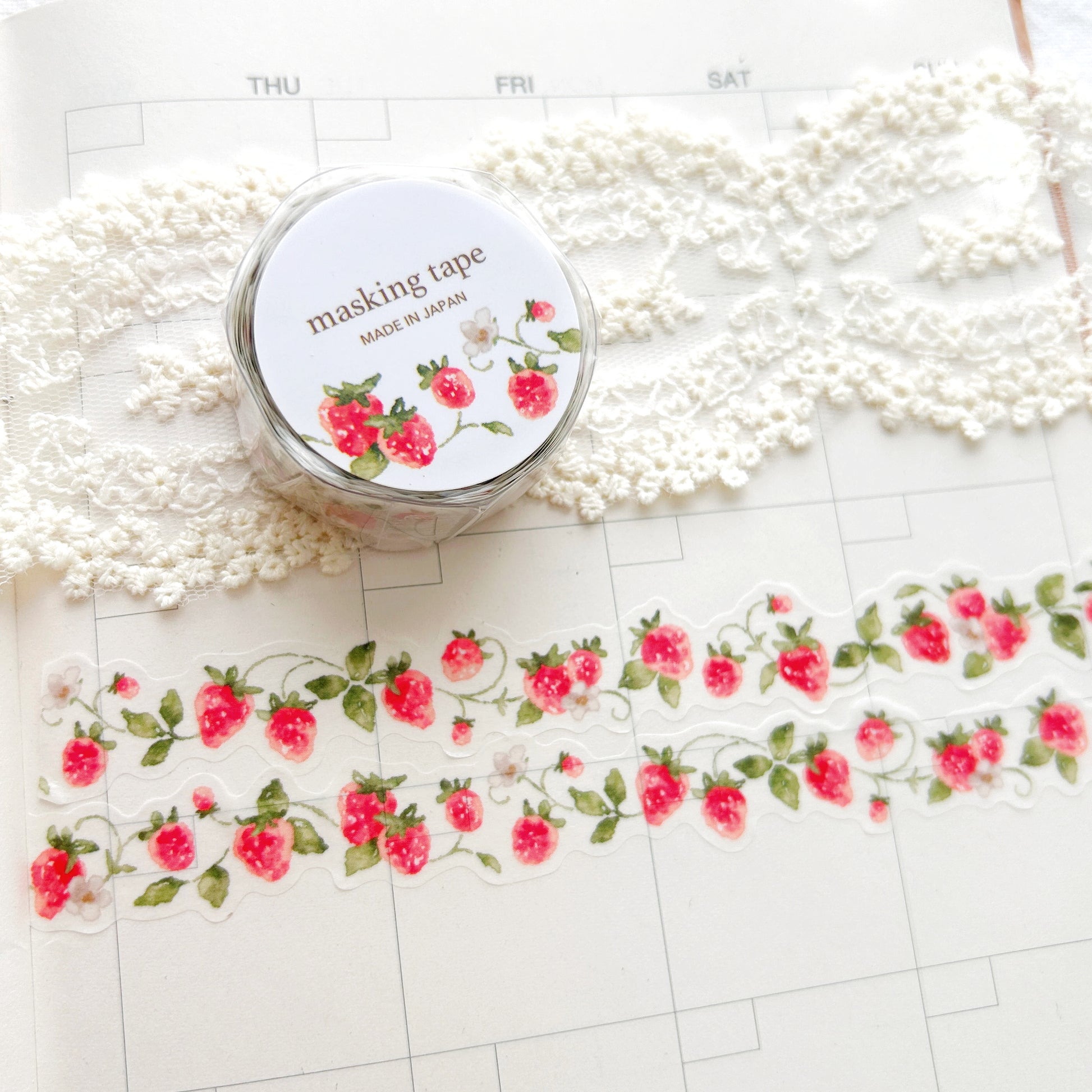 Washi tape with a whimsical strawberry on the vine design on a planner