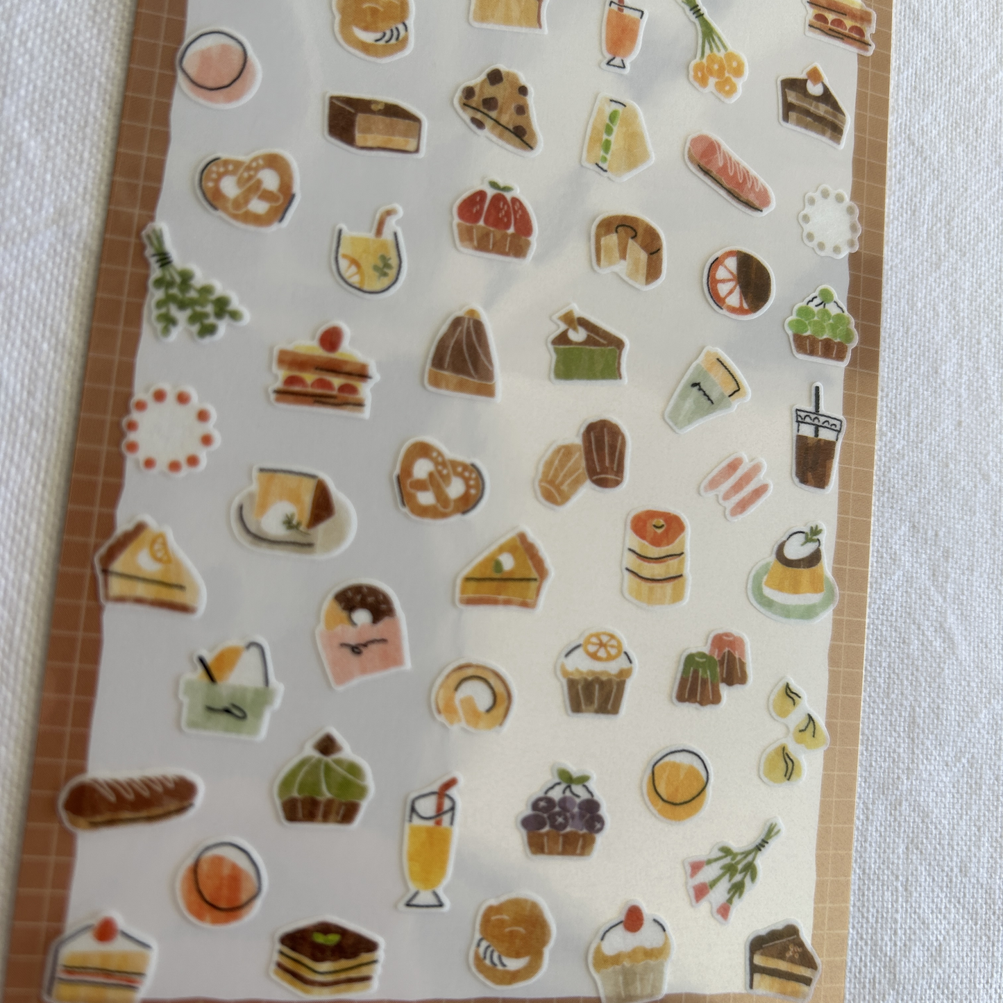 Mind Wave Cozy Sticker - Sweets. With touches of sweetness and delicate details, these stickers are perfect for adding a dash of indulgence to journals, planners, and scrapbooks.