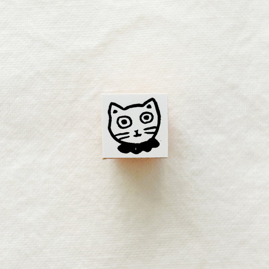 Small wooden rubber stamp of a white cat