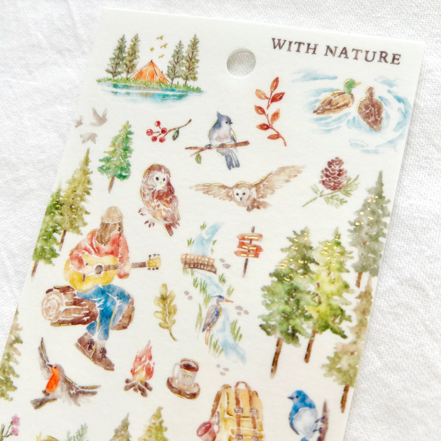 Sticker sheet features soothing watercolor style illustrations of peaceful moments among feathered bird friends adorned with delicate gold foil details