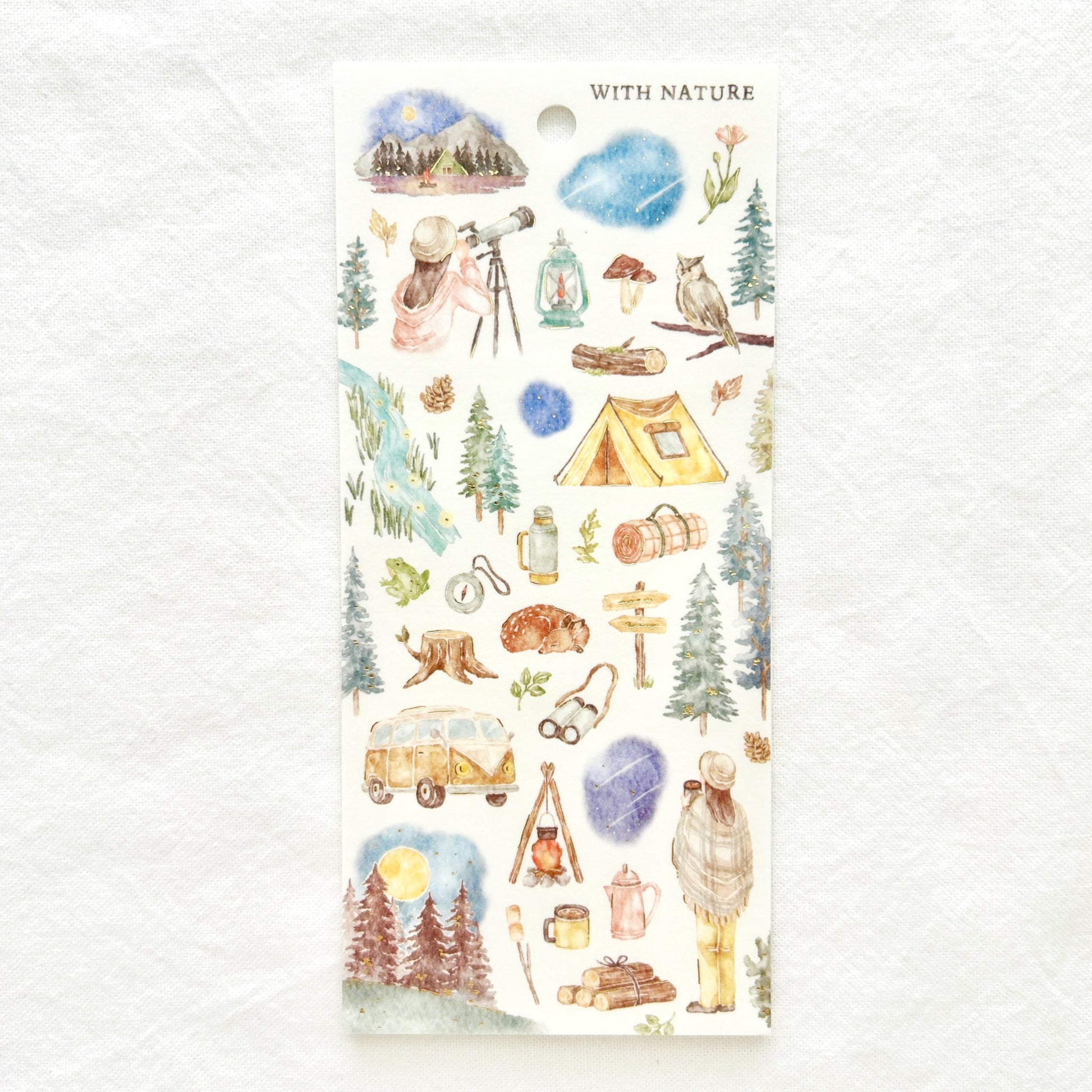 Sticker sheet  features soothing watercolor style illustrations of the wonders of the night sky adorned with delicate gold foil details. 